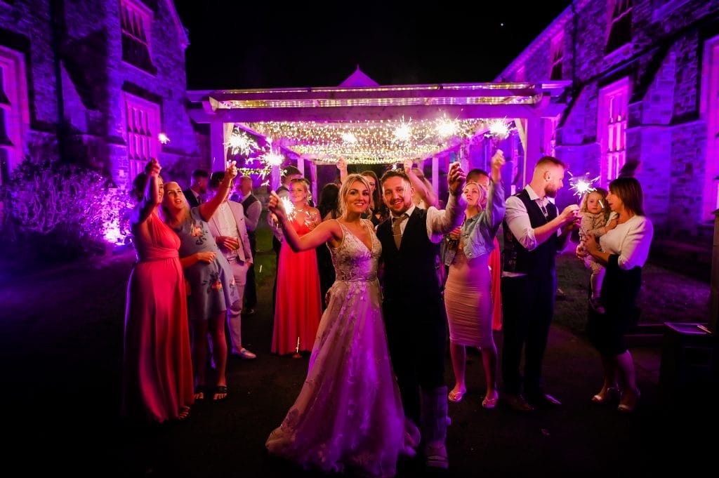 a group of people holding sparklers