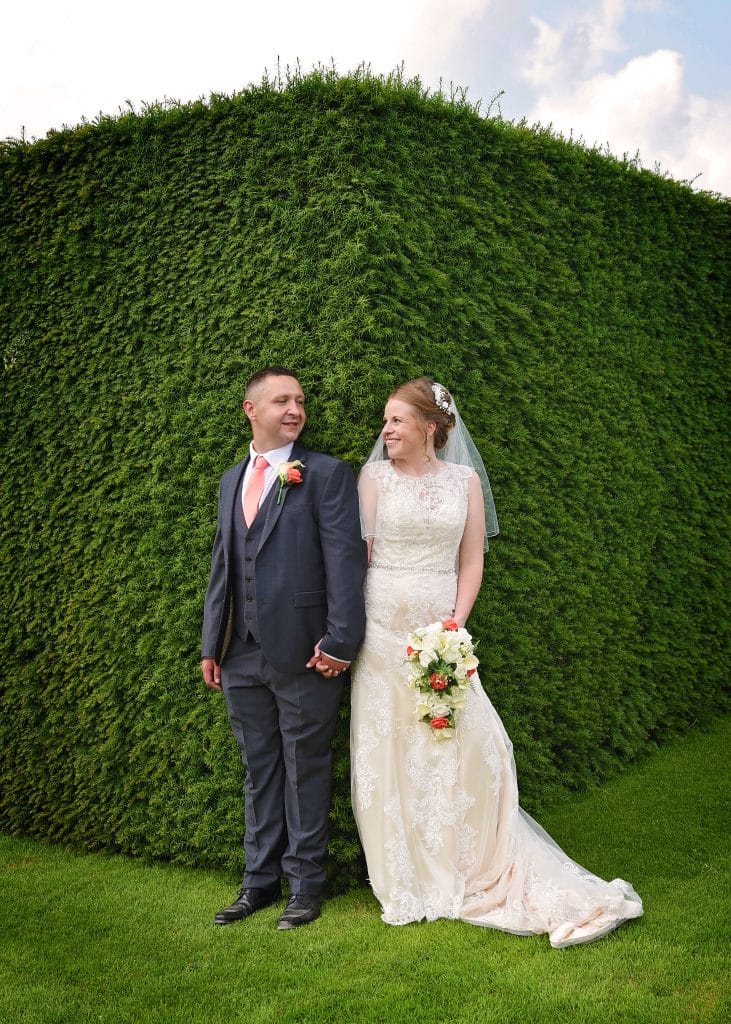 a man and woman in wedding attire
