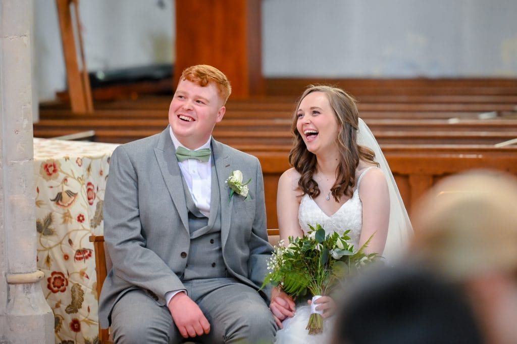 a man and woman sitting in a chair