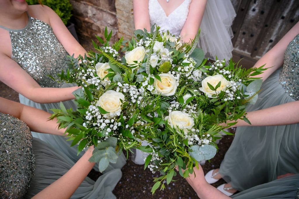 a group of women holding flowers
