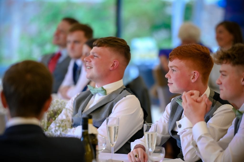 a group of men sitting at a table