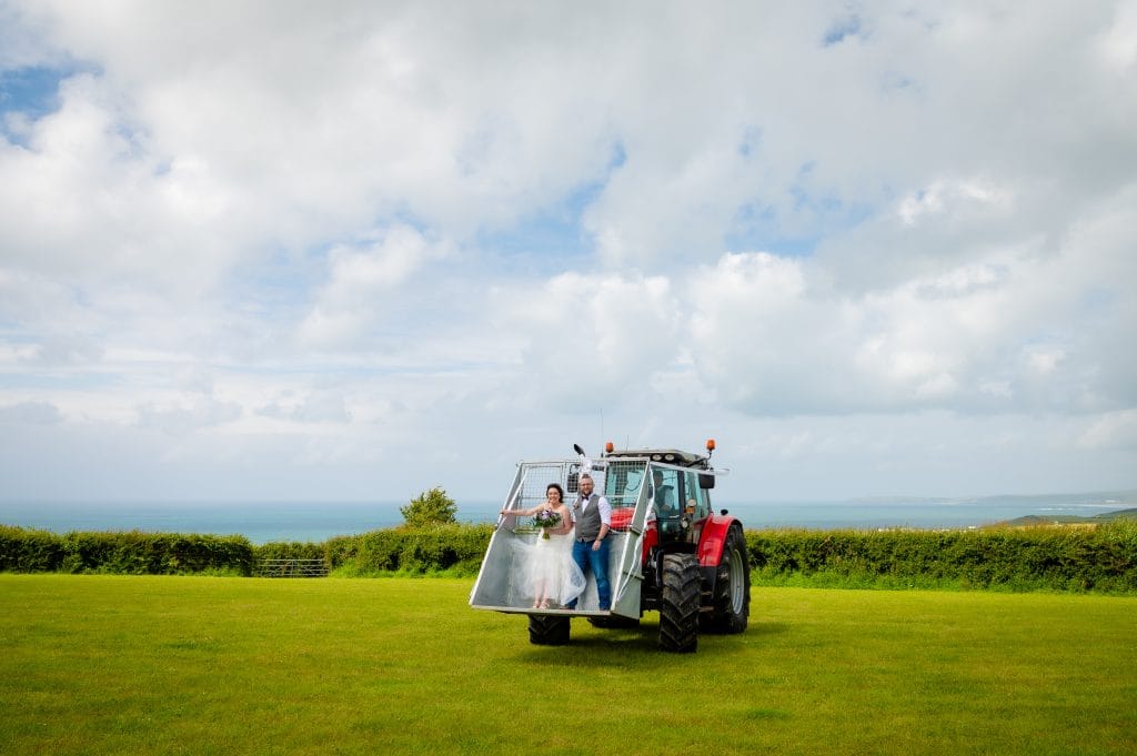 a man and woman on a tractor