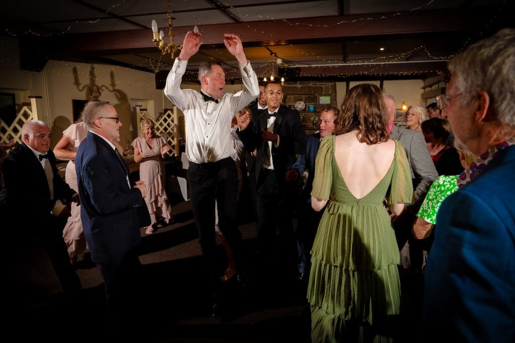 a group of people dancing in a room