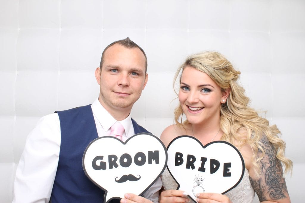 a man and woman holding signs