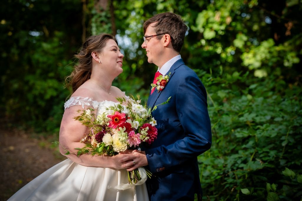 a man and woman holding flowers