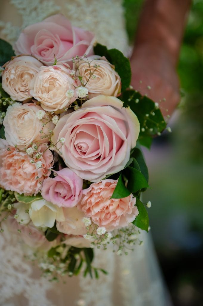 a person holding a bouquet of flowers