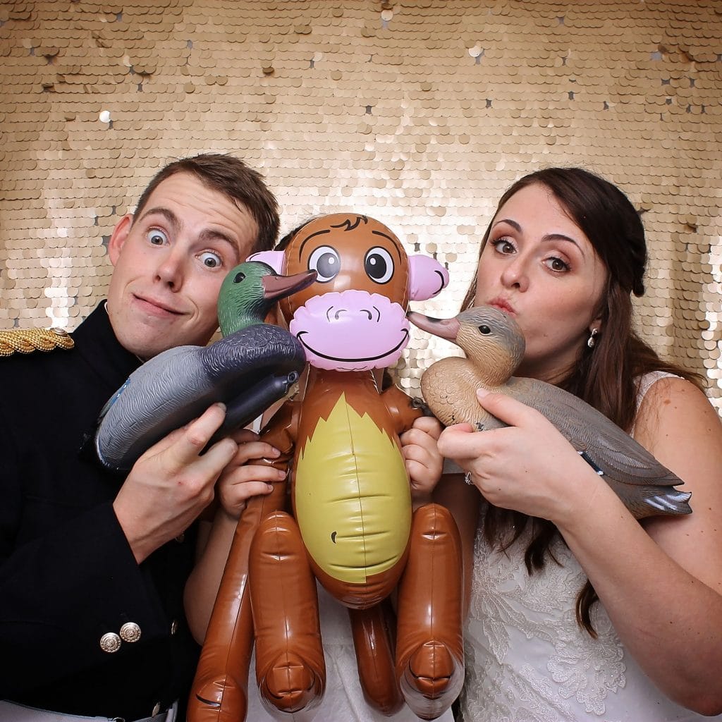 a man and woman holding balloons