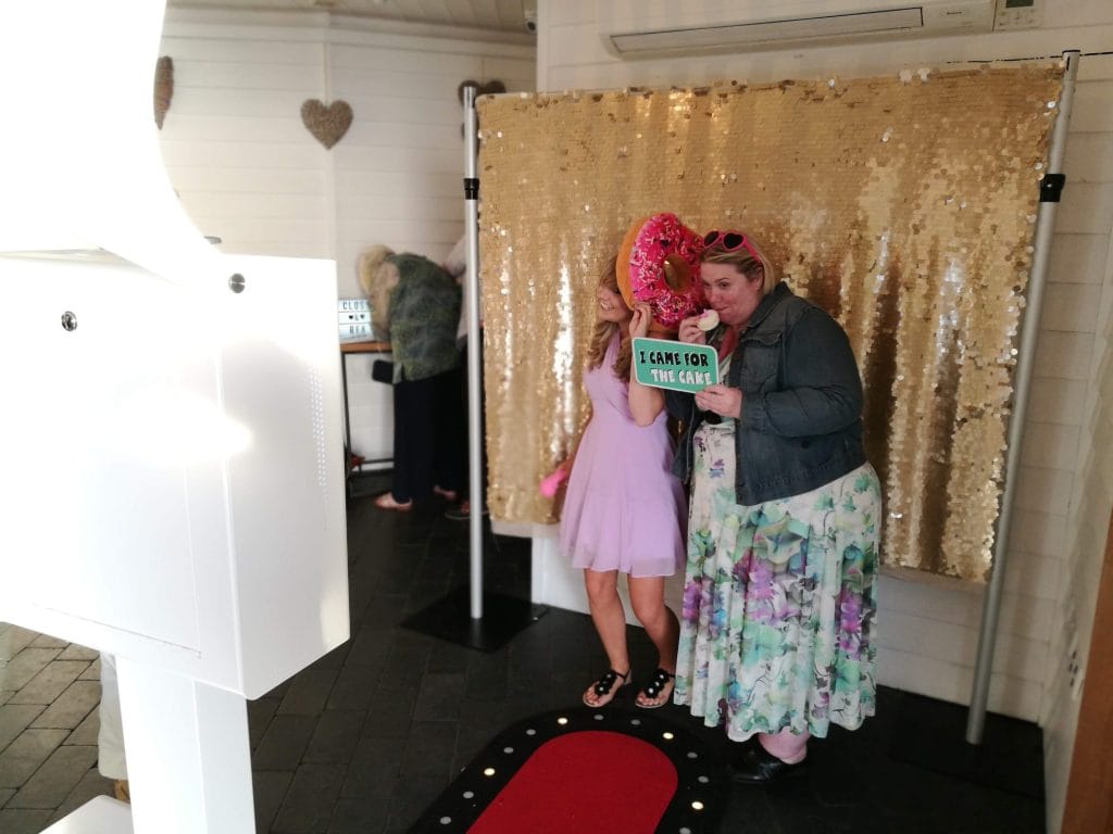 a group of women standing in front of a sign