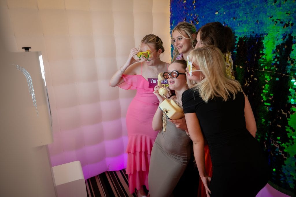 a group of women in dresses