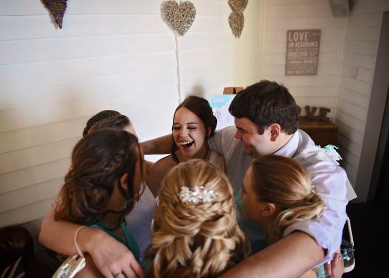 a group of people hugging each other