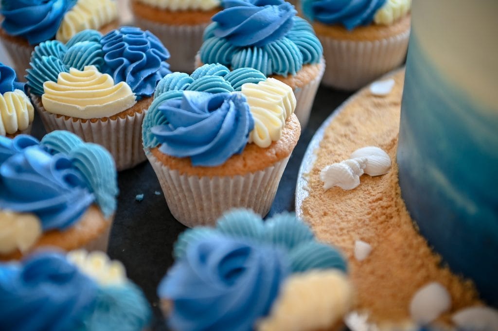 a group of cupcakes with blue frosting